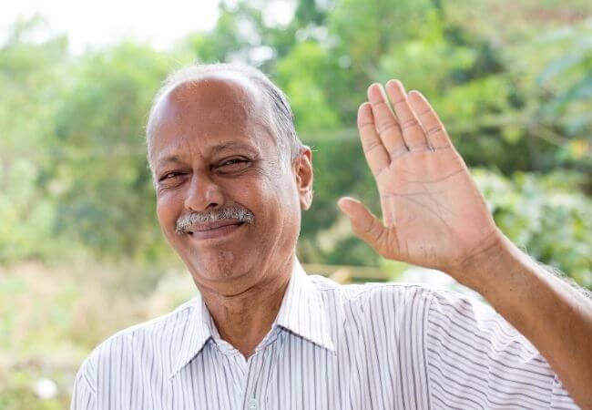 Indian man waving hand